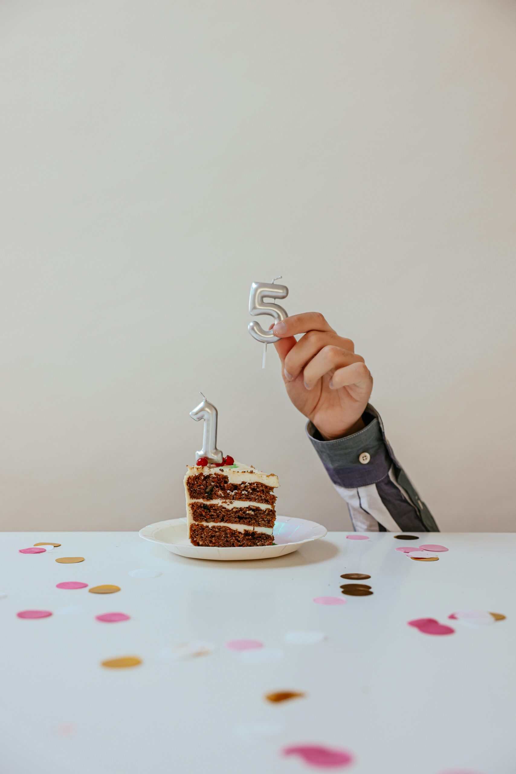 A slice of cake with '15' candles, perfect for birthdays or anniversaries.